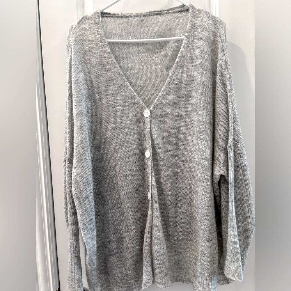 Light cardigan sweater. Light gray.
